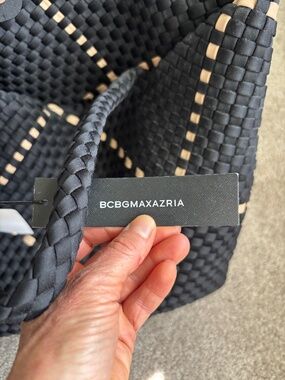 Black and tan woven summer tote with mini bag inside